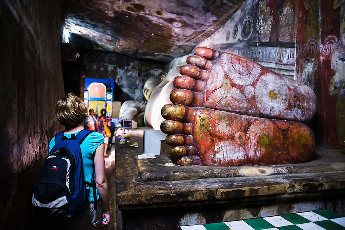 Dambulla Cave Temples, tourist visiting Cave 1 (aka Cave of the Divine King or Temple of the King of the Gods), Dambulla, Central Province, Sri Lanka, Asia